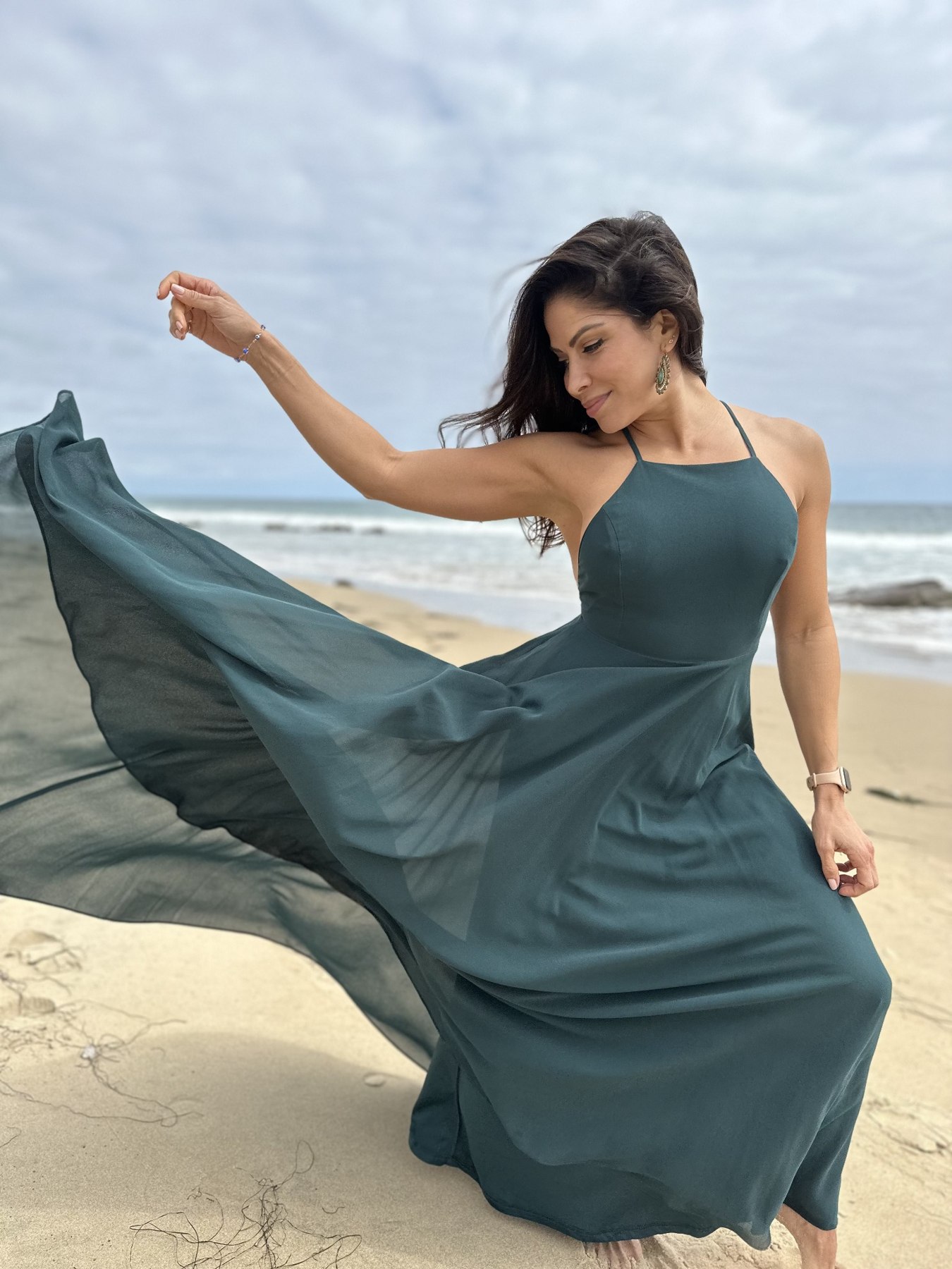 Valery in a flowing dress by the ocean